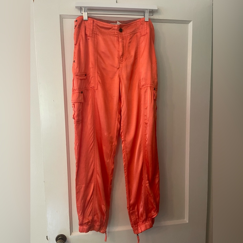 The cutest NWOT Orange silky Marrakech cargo pants. Never been worn. Size 27
